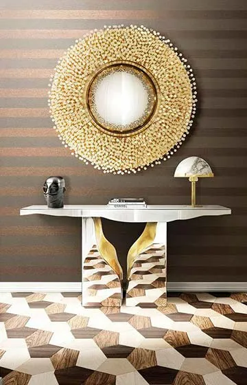 Luxury entrance console designed by Aces Design Studio in Gżira, Malta, featuring bespoke furniture, decorative mirror, premium lighting, geometric flooring, elegant accessories, and sophisticated residential interior styling.
